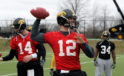 Iowa quarterbacks Ricky Stanzi (12) and John Wienke (14) workout during the team's practice March 25, 2009 at the Kenyon Football Practice Facility in Iowa City.  (Brian Ray/The Gazette)