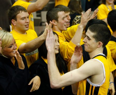 Iowa's Jake Kelly, right, high fives the crowd after Iowa beat Penn State 75-67, in double overtime March 7, 2009. Kelly led Iowa with 22 points. (AP Photo /Matthew Putney)