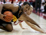 Iowa's Jeff Peterson, left, and Wisconsin's Joe Krabbenhoft go after a loose ball during the first half of an NCAA college basketball game Wednesday, Feb. 11, 2009, in Madison, Wis. (AP Photo/Andy Manis)