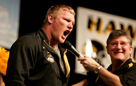 Iowa's Mitch King shouts as he addresses the crowd during the Hawkeye Huddle at the Tampa Convention Center on Dec. 30, 2008, in Tampa, Fla. At right is Gary Dolphin. (Jim Slosiarek/The Gazette)t