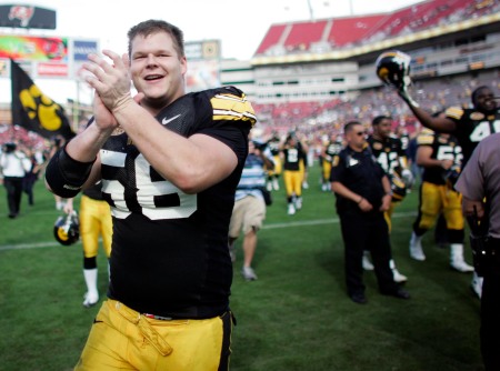 Rob Bruggeman runs to the fan section to sing the Iowa fight song after their 31-10 victory over the South Carolina Gamecocks at the Outback Bowl at Raymond James Stadium in Tampa, Fla., Jan. 1, 2009.   (Jonathan D. Woods/The Gazette)