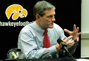 University of Iowa Head Football Coach Kirk Ferentz talks about the design of the brace that quarterback Drew Tate has been fitted with to protect his injured left hand at his weekly press conference Tuesday, October 31, 2006 in Iowa City. Ferentz said expected Tate to start Saturday's game unless something unexpected developed in practice this week.