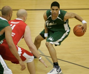 Incoming Iowa freshman basketball player Aaron Fuller of Lucky Pawz/Premier Investments looks for a way past  Goodfellow Printing/Imprinted Sportswear's Greg Brunner  in a Prime Time league game at the North Liberty Community Center on June 25, 2008. (Cliff Jette/The Gazette)