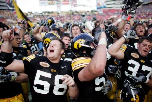 Iowa center Rob Bruggeman leads the team and fans in the fight song after their 31-10 victory over the South Carolina Gamecocks at the Outback Bowl at Raymond James Stadium in Tampa Bay, Fla., on Jan. 1, 2009. (Jonathan D. Woods/The Gazette)