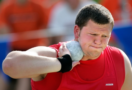 Marion senior Drew Clark concentrates as he makes his record-breaking throw of 64 feet, 7 3/4 inches during the 2009 Class 3A state track meet Friday, May 22, 2009 at Drake Stadium in Des Moines. (Brian Ray/The Gazette)