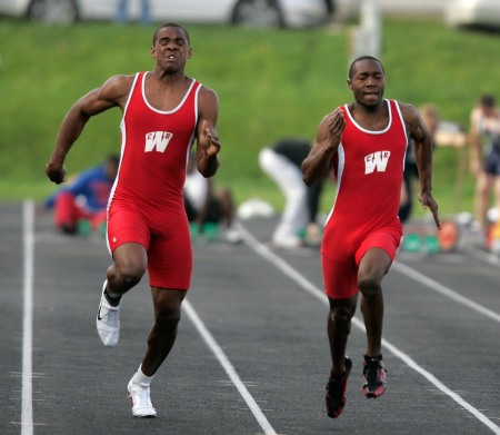 Keenan Davis (left) and Ronnie Henderson, both of Cedar Rapids Washington, compete in the 100-meter dash finals during the 23rd annual Warrior Wilkinson Relays at Thomas Park in Marion on May 1, 2009. (Cliff Jette/The Gazette)