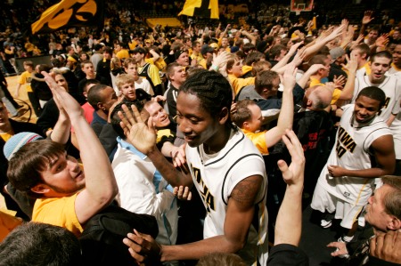 Iowa's Kurt Looby is congratulated by a floor full of fans as the Hawkeyes leave the court after defeating Michigan State at Carver-Hawkeye Arena in Iowa City on Jan. 12, 2008. (Cliff Jette/The Gazette)